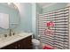 Cute bathroom with a wood vanity, gold fixtures, and a Barbie shower curtain at 4335 Piper Glen Dr, Charlotte, NC 28277