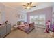 Purple-themed bedroom with a window, grey furniture, floral decals, and a unicorn picture at 4335 Piper Glen Dr, Charlotte, NC 28277