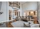 Expansive living room with hardwood floors, open concept design, and access to multiple rooms at 4335 Piper Glen Dr, Charlotte, NC 28277