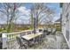 Outdoor patio featuring ample seating and a scenic view of a tranquil lake at 4335 Piper Glen Dr, Charlotte, NC 28277