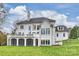 Expansive home with a large terrace, multiple windows, and a well-manicured lawn, perfect for outdoor living at 4335 Piper Glen Dr, Charlotte, NC 28277