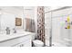 Modern bathroom boasts sleek fixtures, a glass-enclosed shower, and elegant neutral decor at 469 Court House Ave, York, SC 29745