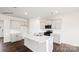 Modern kitchen showcases a large island with bar seating and modern stainless steel appliances at 469 Court House Ave, York, SC 29745