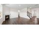 Spacious living room features a fireplace, staircase, and seamless transition to other living spaces at 469 Court House Ave, York, SC 29745