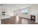 Open living room features a fireplace, large windows, and access to the backyard at 469 Court House Ave, York, SC 29745