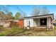 Backyard view of the house with a brick exterior at 4914 Ridgeley Dr, Charlotte, NC 28208