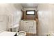 A bathroom featuring a walk-in bathtub for easy access and a window at 4914 Ridgeley Dr, Charlotte, NC 28208