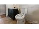 Bathroom featuring a toilet and a vanity with a dark finish at 4914 Ridgeley Dr, Charlotte, NC 28208