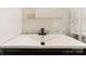 Bathroom sink and vanity featuring modern faucet and design at 4914 Ridgeley Dr, Charlotte, NC 28208