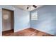 Bedroom featuring hardwood floors and a window at 4914 Ridgeley Dr, Charlotte, NC 28208