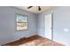 Bedroom featuring hardwood floors and a window at 4914 Ridgeley Dr, Charlotte, NC 28208