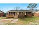 Charming single-story home with a cozy front porch and well-maintained lawn at 4914 Ridgeley Dr, Charlotte, NC 28208