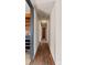 Hallway with hardwood floors and multiple doors at 4914 Ridgeley Dr, Charlotte, NC 28208