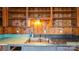 The kitchen has wood cabinets, a double sink, and a teal countertop at 4914 Ridgeley Dr, Charlotte, NC 28208
