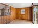 Shows a room featuring wood walls, an open design and a window to the outside at 4914 Ridgeley Dr, Charlotte, NC 28208
