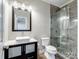 Modern bathroom with a sleek vanity, toilet, and walk-in shower with glass enclosure at 501 Colonels Ct, Clover, SC 29710