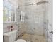 This bathroom has a white marble tiled shower with glass enclosure, a mosaic floor and a window with blinds at 501 Colonels Ct, Clover, SC 29710