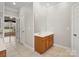 Bathroom featuring a sink, vanity, tiled floor, and an entrance to the living area at 501 Colonels Ct, Clover, SC 29710