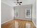 Bright bedroom featuring hardwood floors, a ceiling fan, and dual windows for natural light at 501 Colonels Ct, Clover, SC 29710