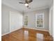 Inviting bedroom with hardwood floors, double windows, closet, and neutral walls, ready for personal touches at 501 Colonels Ct, Clover, SC 29710