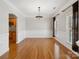 Dining area with hardwood floors, decorative chandelier, and archway to the kitchen at 501 Colonels Ct, Clover, SC 29710