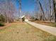 A single-Gathering home with brick and siding, a long driveway and a two-car garage at 501 Colonels Ct, Clover, SC 29710