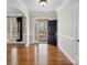 Elegant foyer featuring hardwood floors, arched entryways, and a stylish black front door at 501 Colonels Ct, Clover, SC 29710