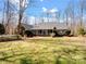 Spacious home with a manicured lawn, brick siding, and a charming front porch and garden at 501 Colonels Ct, Clover, SC 29710