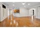 Spacious living room featuring hardwood floors, open layout, and access to kitchen at 501 Colonels Ct, Clover, SC 29710