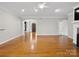 Bright living room with hardwood floors and an arched entryway to the front door at 501 Colonels Ct, Clover, SC 29710