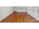 An empty living room featuring hardwood floors and lots of natural light at 501 Colonels Ct, Clover, SC 29710