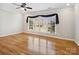 Sun-drenched living room with hardwood floors and a large window offering a pleasant outdoor view at 501 Colonels Ct, Clover, SC 29710