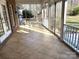 This is a screened-in patio with tile flooring and white railings, providing a relaxing outdoor space at 501 Colonels Ct, Clover, SC 29710