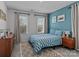 Bedroom featuring a checkered-patterned bed set, natural light, and matching night stands for a relaxing atmosphere at 5056 Blue Serenity Ct, Denver, NC 28037