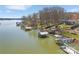 Picturesque lakefront property with boat docks and lush greenery at 5064 Lynwood Rd, Sherrills Ford, NC 28673