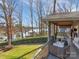 Spacious back porch showcases serene lake views and complements the well-maintained backyard at 5064 Lynwood Rd, Sherrills Ford, NC 28673