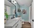 Bright bathroom with white vanity, marble countertop, modern fixtures, and neutral paint at 5064 Lynwood Rd, Sherrills Ford, NC 28673