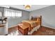 Bedroom featuring wood floors, a small window, and a comfortable bed with warm tones at 5064 Lynwood Rd, Sherrills Ford, NC 28673