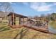 Inviting boat dock featuring a spacious deck with outdoor seating, perfect for relaxing by the water at 5064 Lynwood Rd, Sherrills Ford, NC 28673