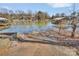 Concrete boat ramp leading into a calm lake with boat docks at 5064 Lynwood Rd, Sherrills Ford, NC 28673