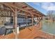 Covered boat storage with a modern boat lift, offering protection and convenience for watercraft enthusiasts at 5064 Lynwood Rd, Sherrills Ford, NC 28673