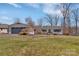 Charming single-story home with a detached garage, nestled on a well-maintained lawn with mature landscaping at 5064 Lynwood Rd, Sherrills Ford, NC 28673