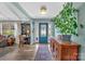 Bright foyer with hardwood floors, decorative blue front door, and a glimpse into the spacious living area at 5064 Lynwood Rd, Sherrills Ford, NC 28673