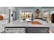 Kitchen island features a large countertop, built-in sink, and stainless steel appliances, ideal for entertaining at 5064 Lynwood Rd, Sherrills Ford, NC 28673