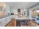 Bright kitchen boasts a central island with seating, brick accent wall, and modern stainless steel appliances at 5064 Lynwood Rd, Sherrills Ford, NC 28673