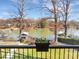 Scenic lake view from balcony framed by mature trees, offering a peaceful retreat at 5064 Lynwood Rd, Sherrills Ford, NC 28673