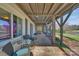 Covered patio with comfortable seating, overlooking a serene lake view at 5064 Lynwood Rd, Sherrills Ford, NC 28673