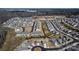 Aerial view of a suburban community featuring many homes and a nearby athletic park at 530 Silers Bald Dr, Fort Mill, SC 29715