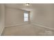 Neutral bedroom featuring plush carpeting, a single window, and ample natural light at 530 Silers Bald Dr, Fort Mill, SC 29715