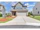 Charming two-story home featuring a two-car garage and manicured front lawn at 530 Silers Bald Dr, Fort Mill, SC 29715